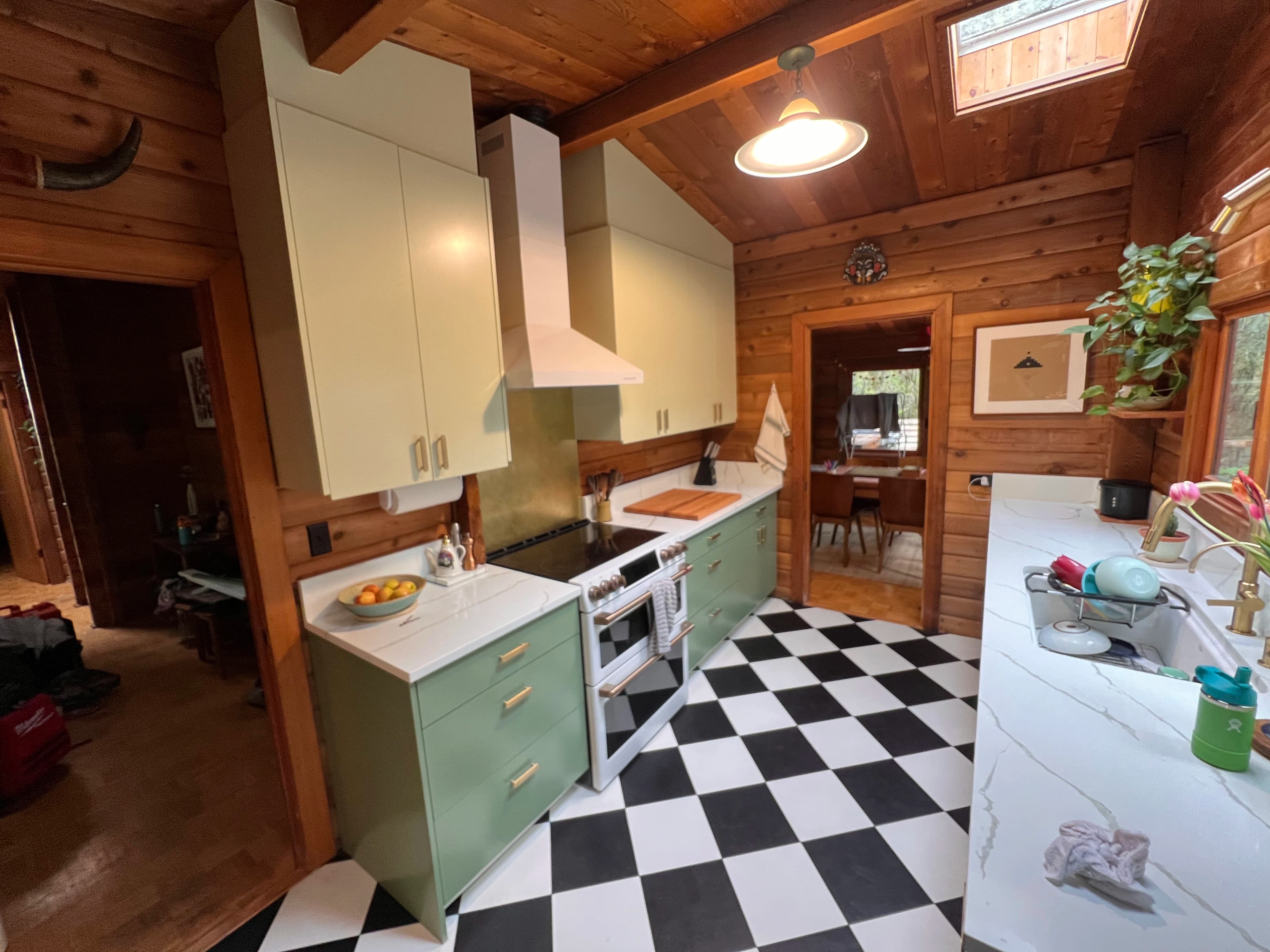 Rustic Checkerboard Cabin Kitchen by CVR Construction