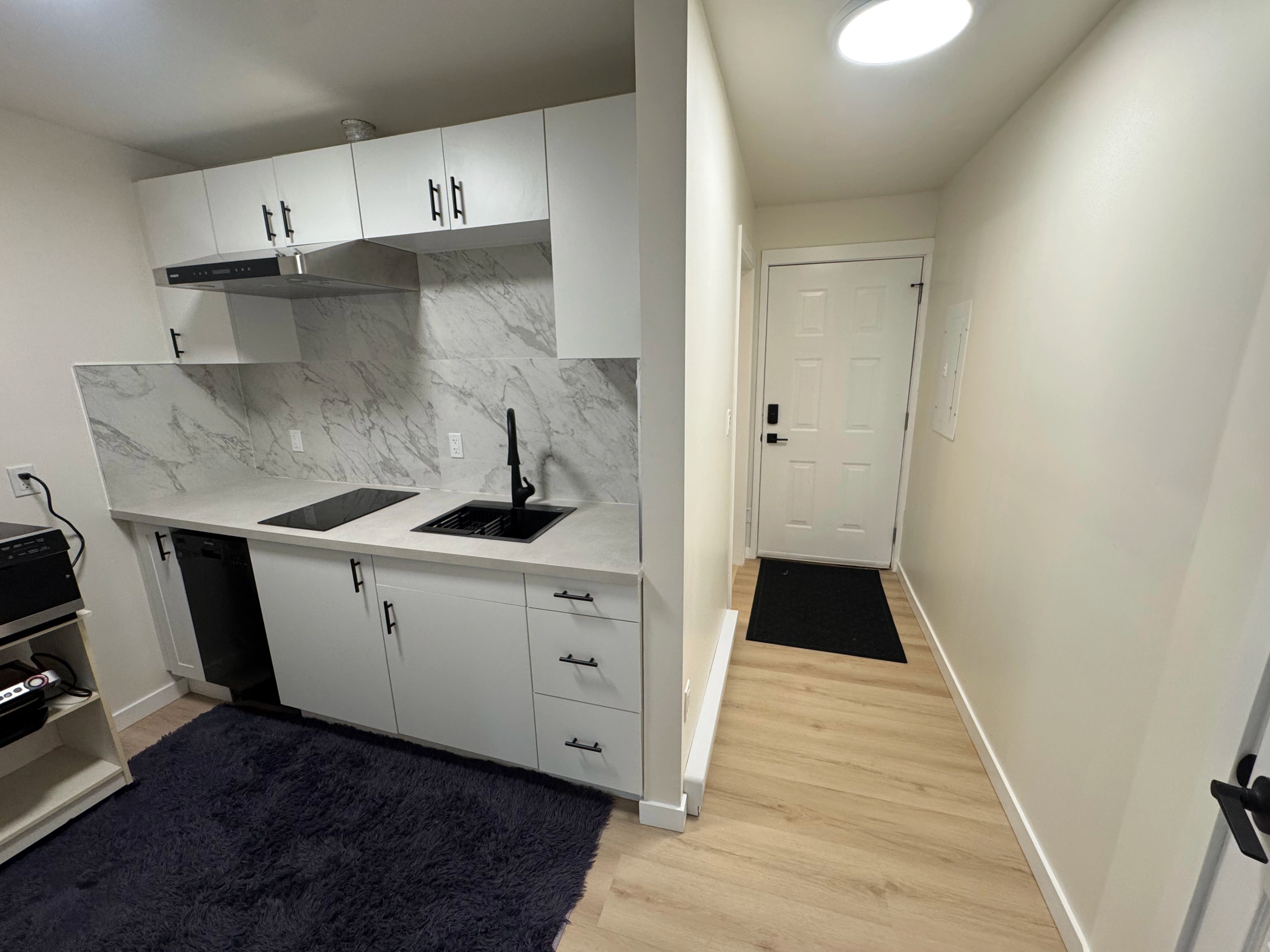 condo kitchen and marble baths by CVR Construction