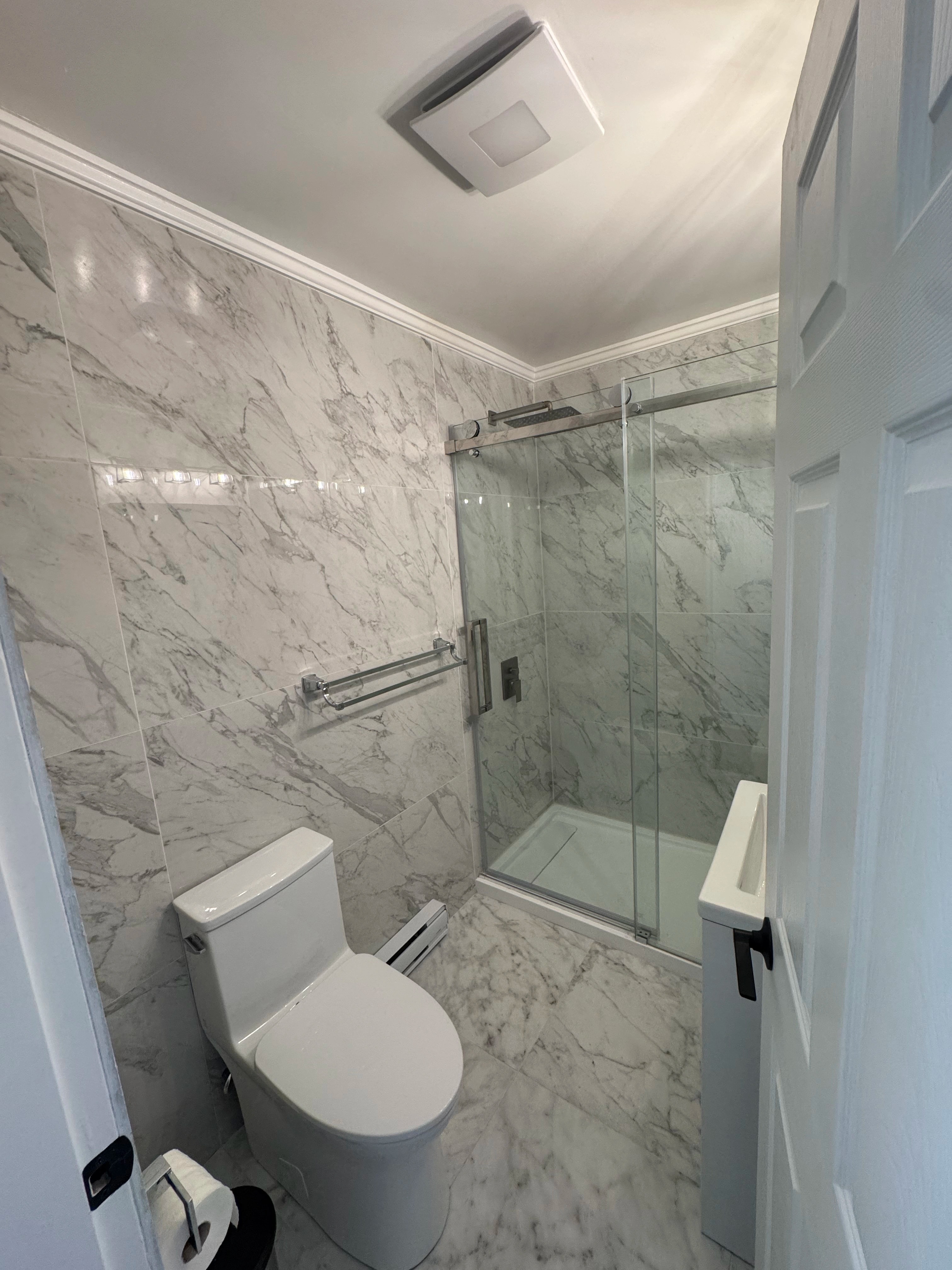 condo kitchen and marble baths by CVR Construction