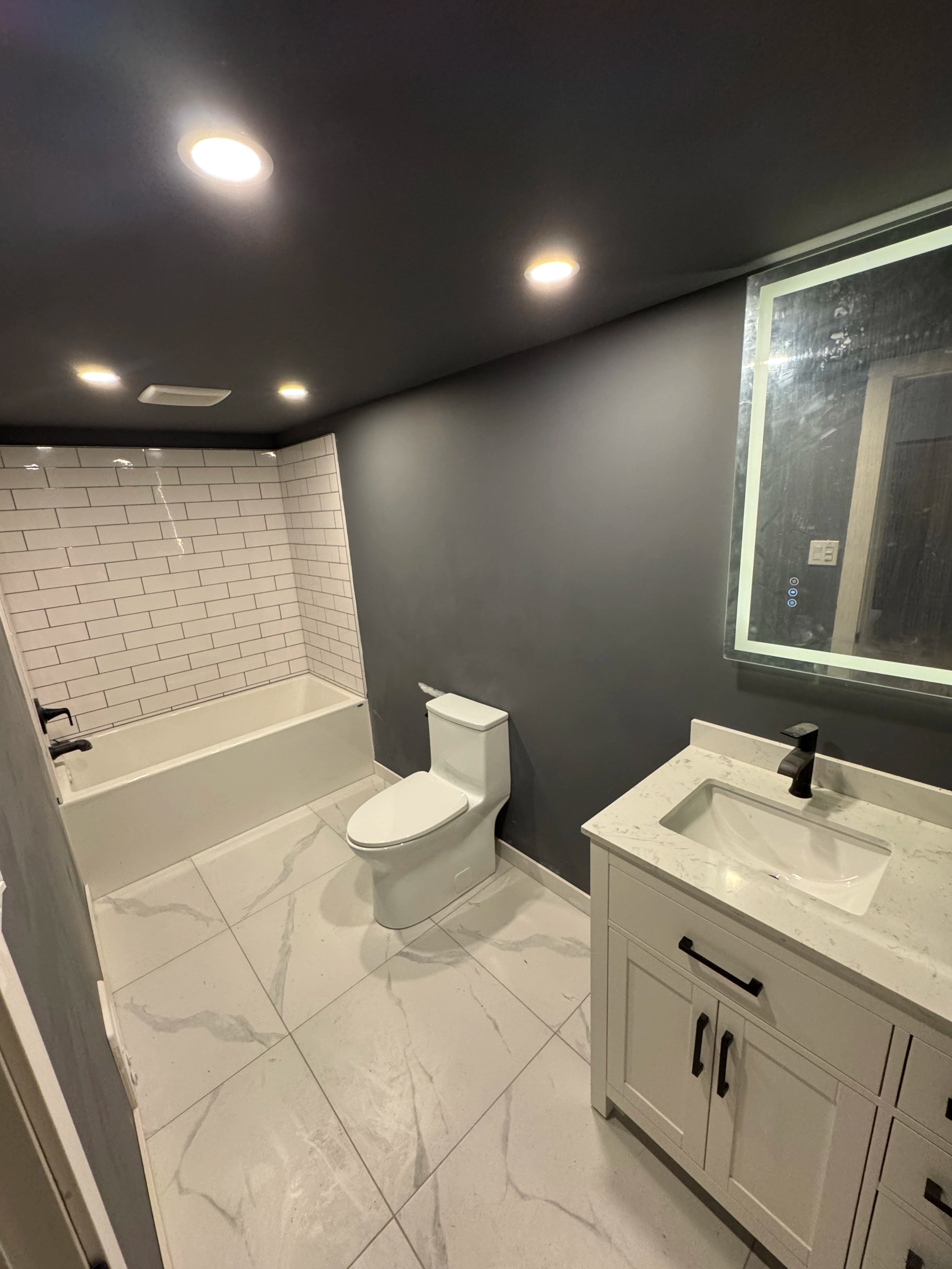 dark gray kitchen and bath by CVR Construction