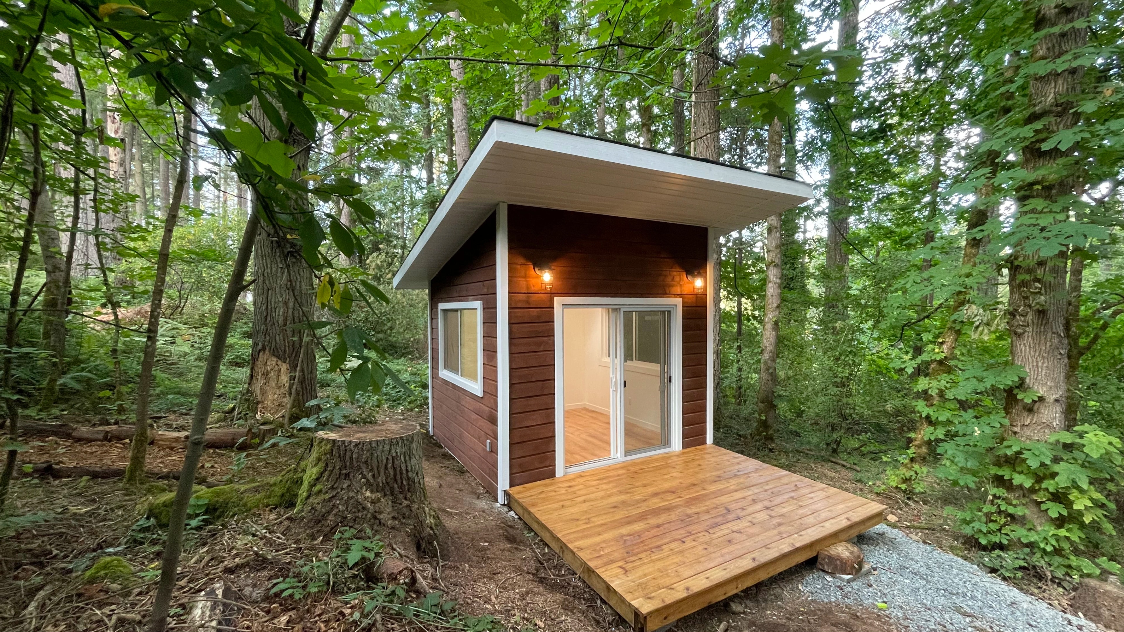 forest cabin and outhouse by CVR Construction