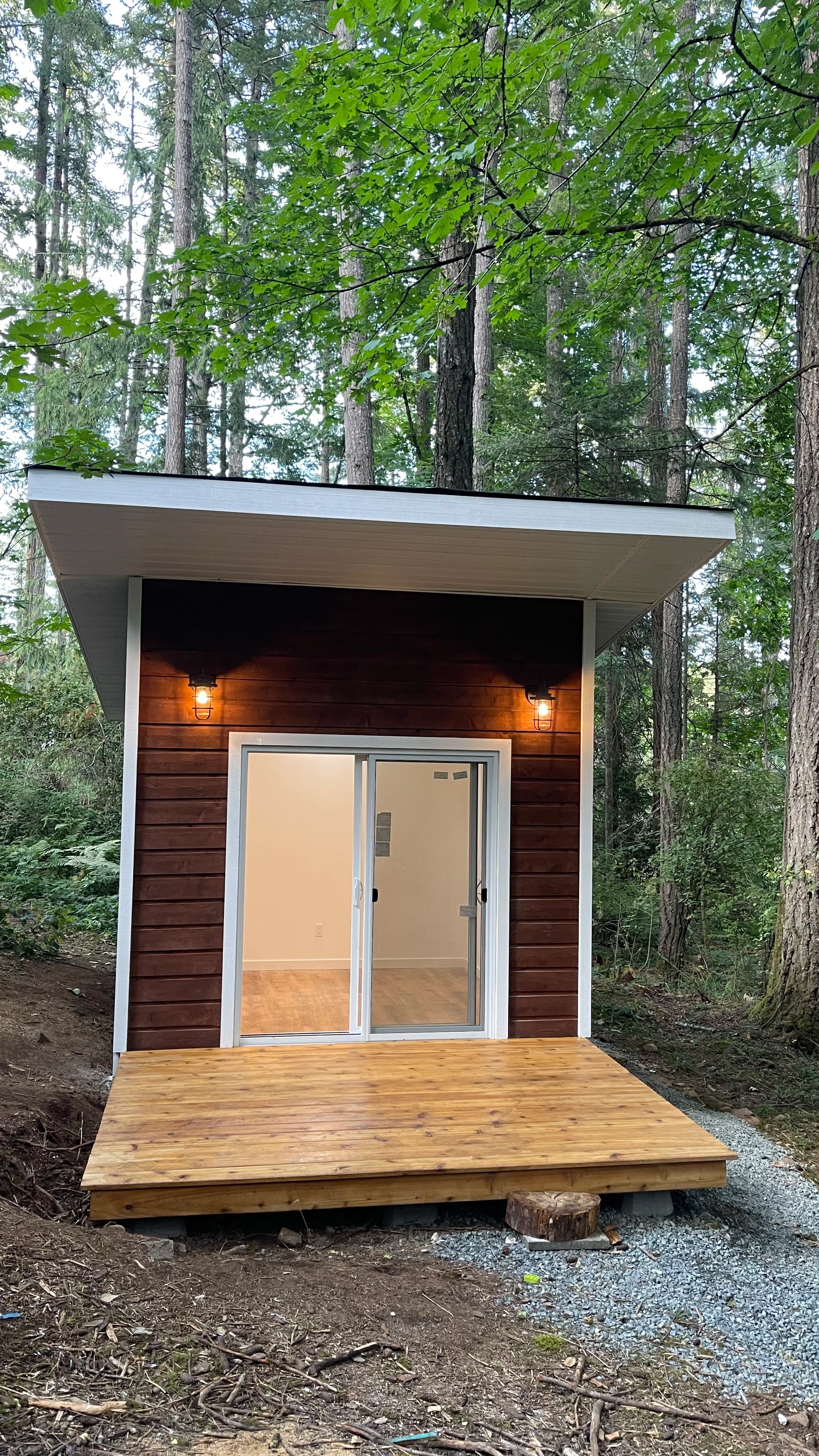 forest cabin and outhouse by CVR Construction