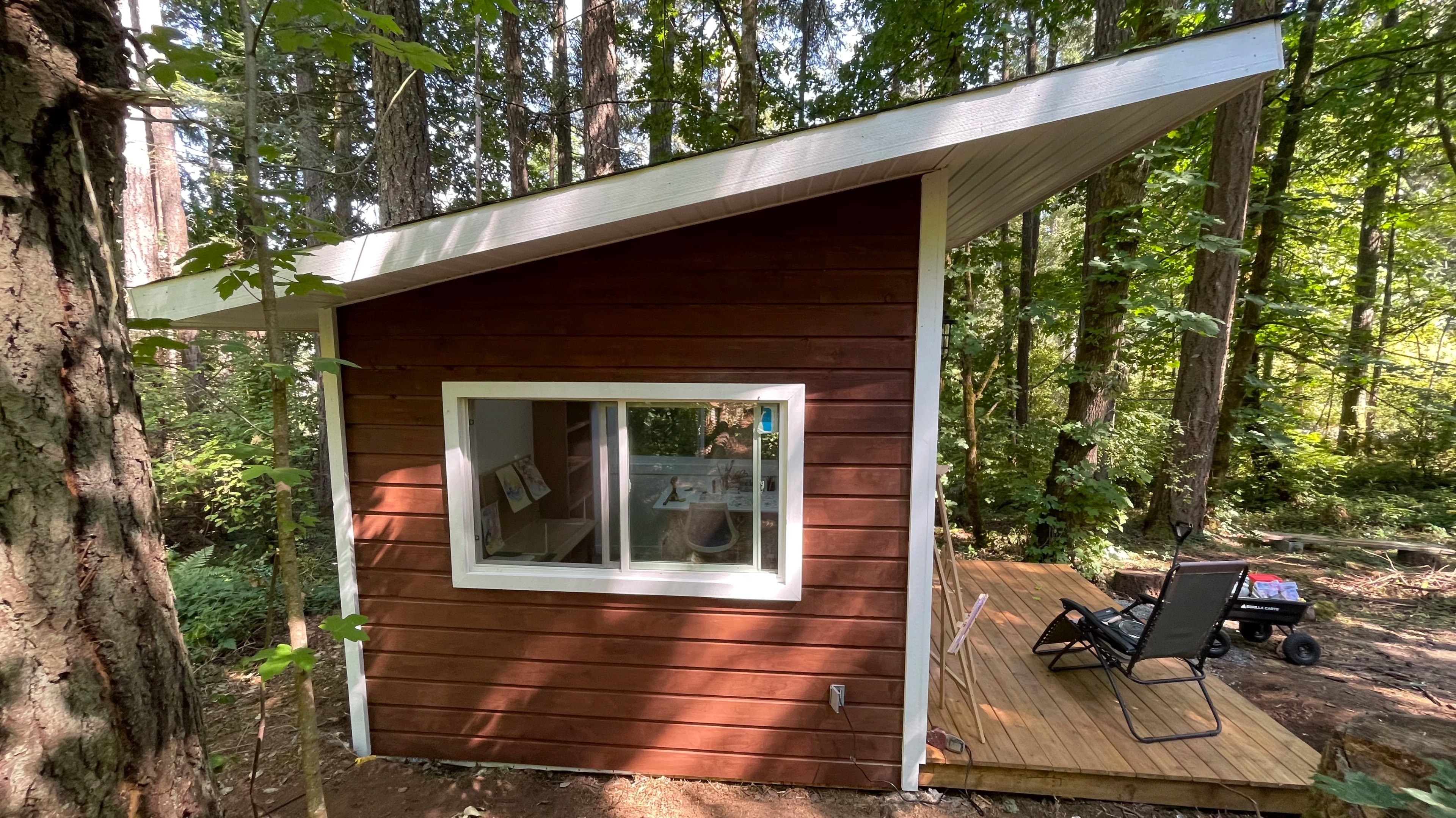 forest cabin and outhouse by CVR Construction