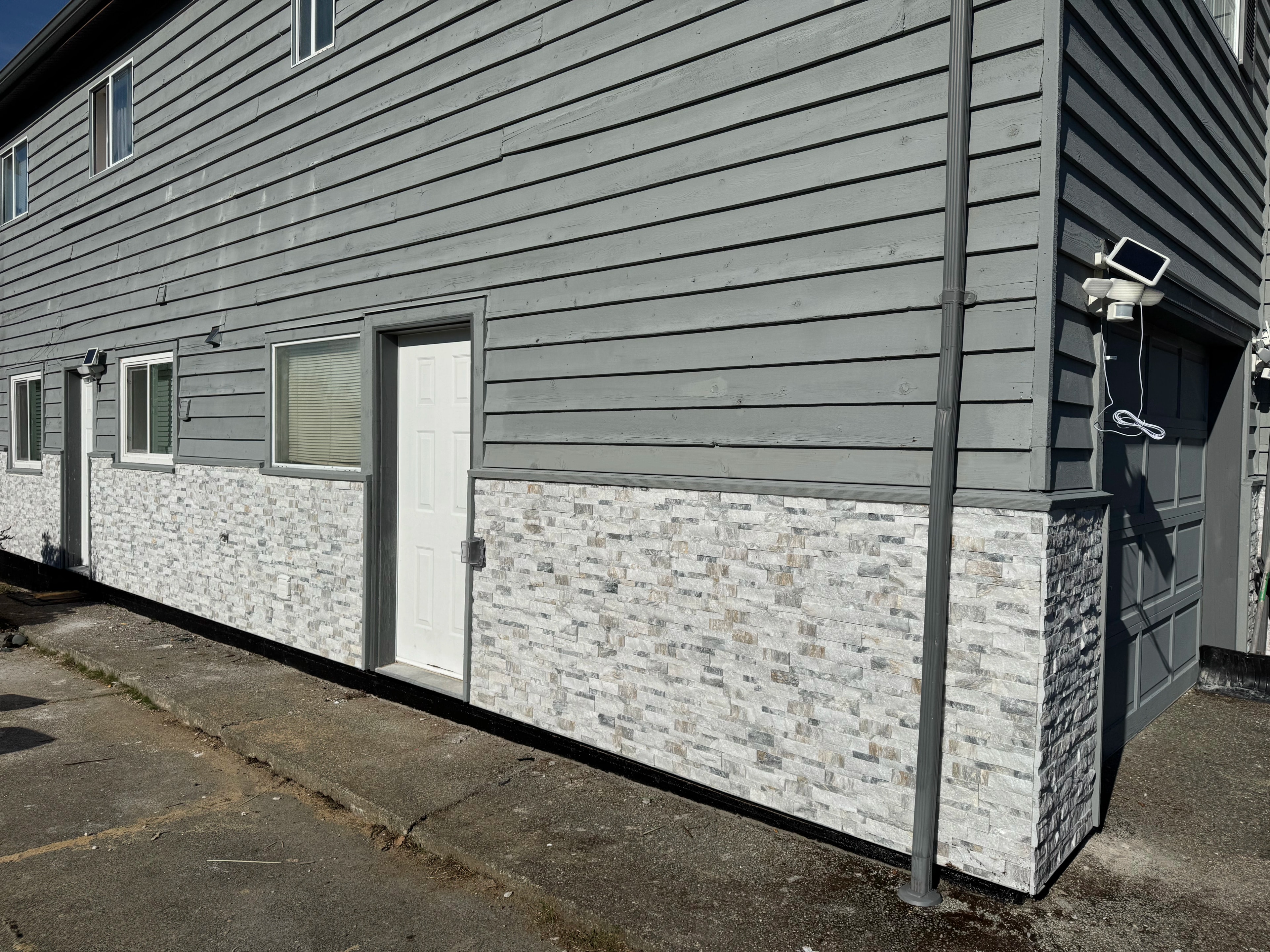 gray siding and forest shed by CVR Construction