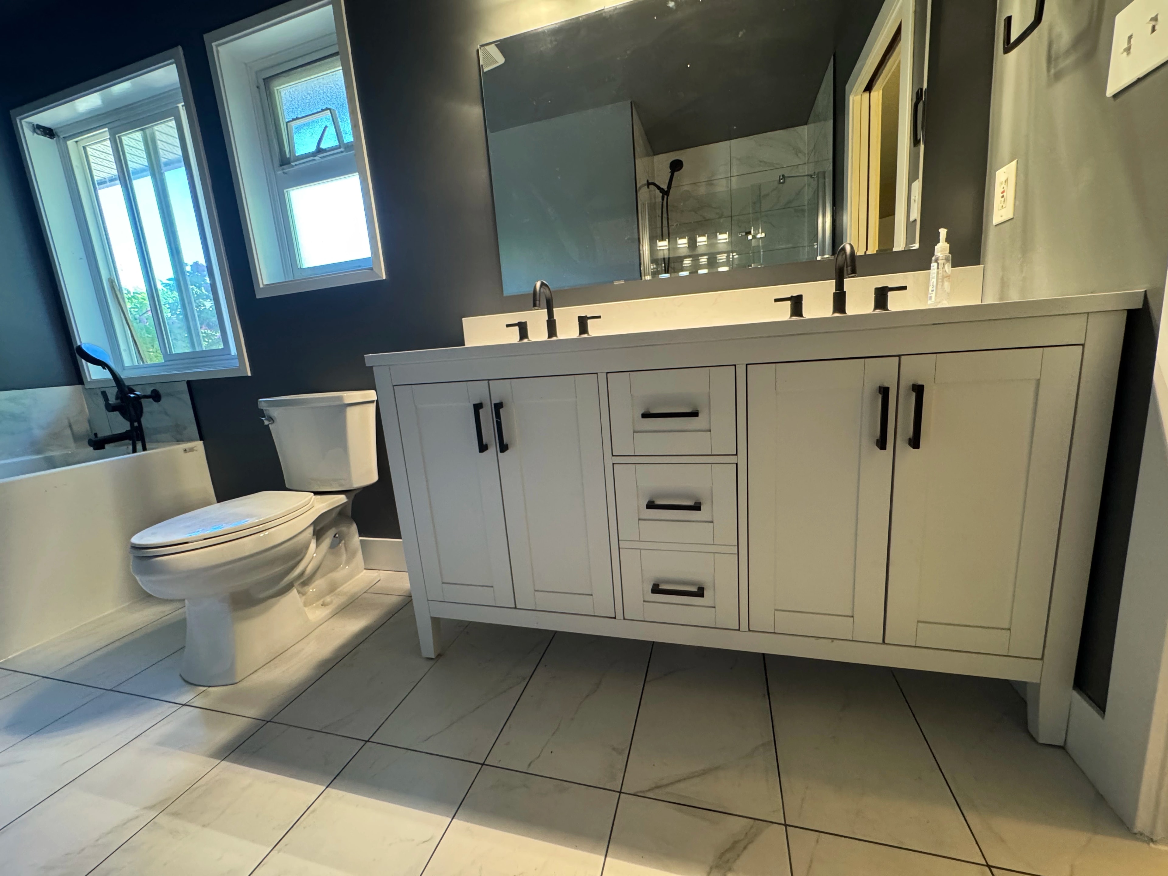 modern bath and laundry suite by CVR Construction