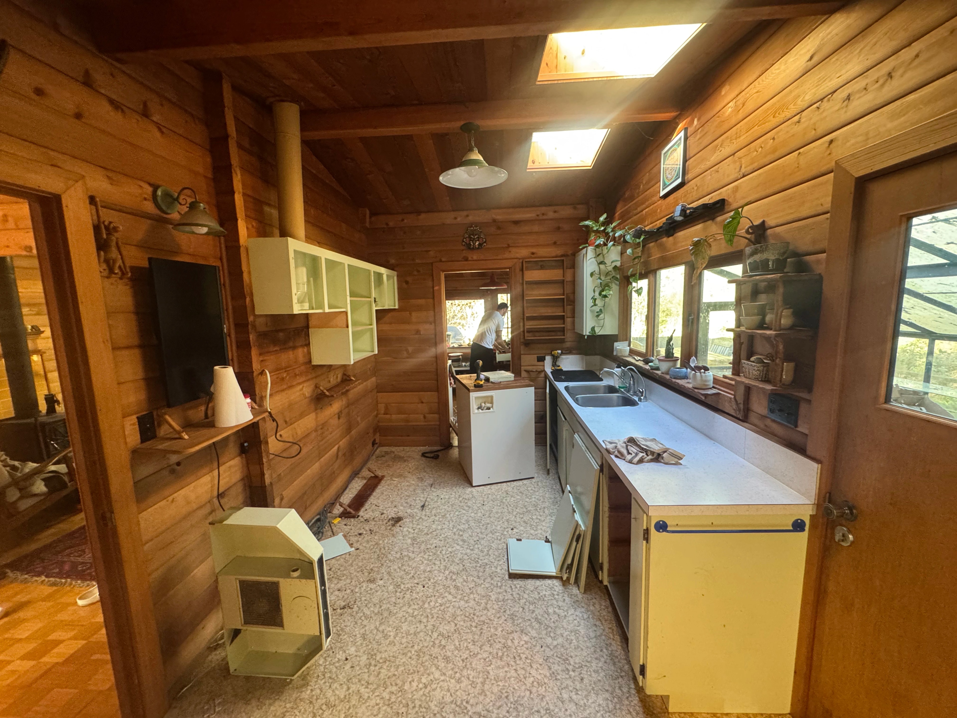 rustic checkerboard cabin kitchen by CVR Construction