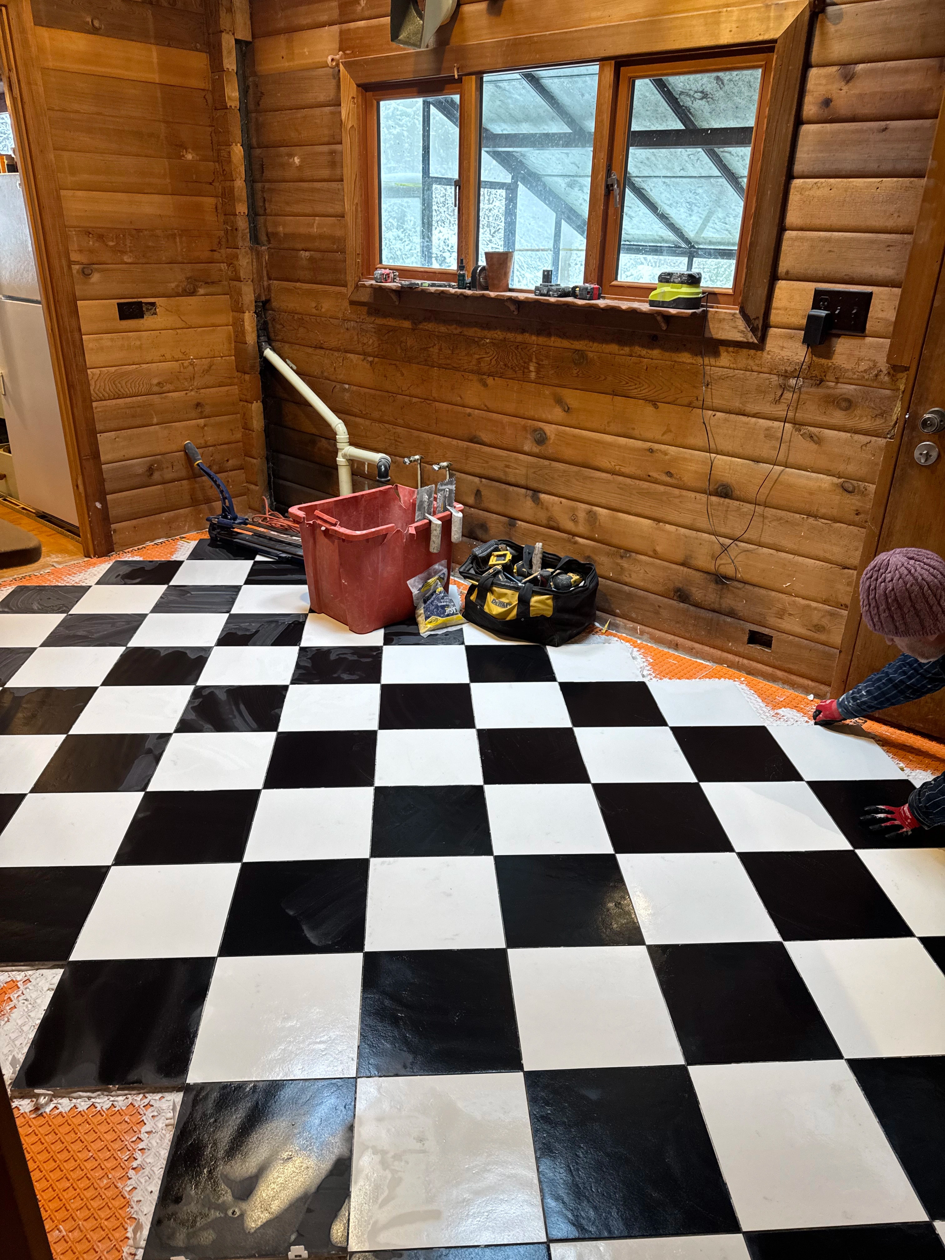 rustic checkerboard cabin kitchen by CVR Construction