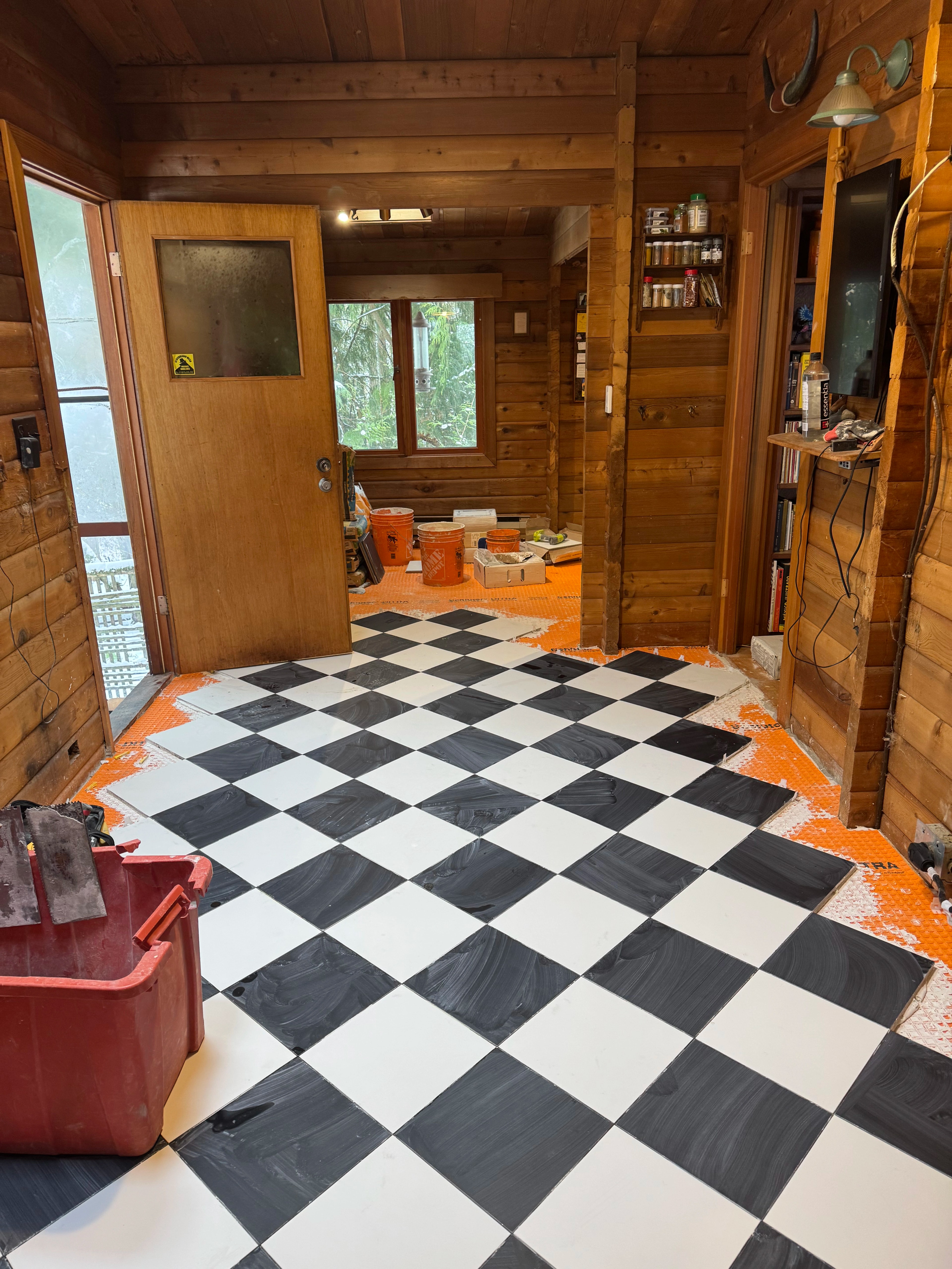 rustic checkerboard cabin kitchen by CVR Construction