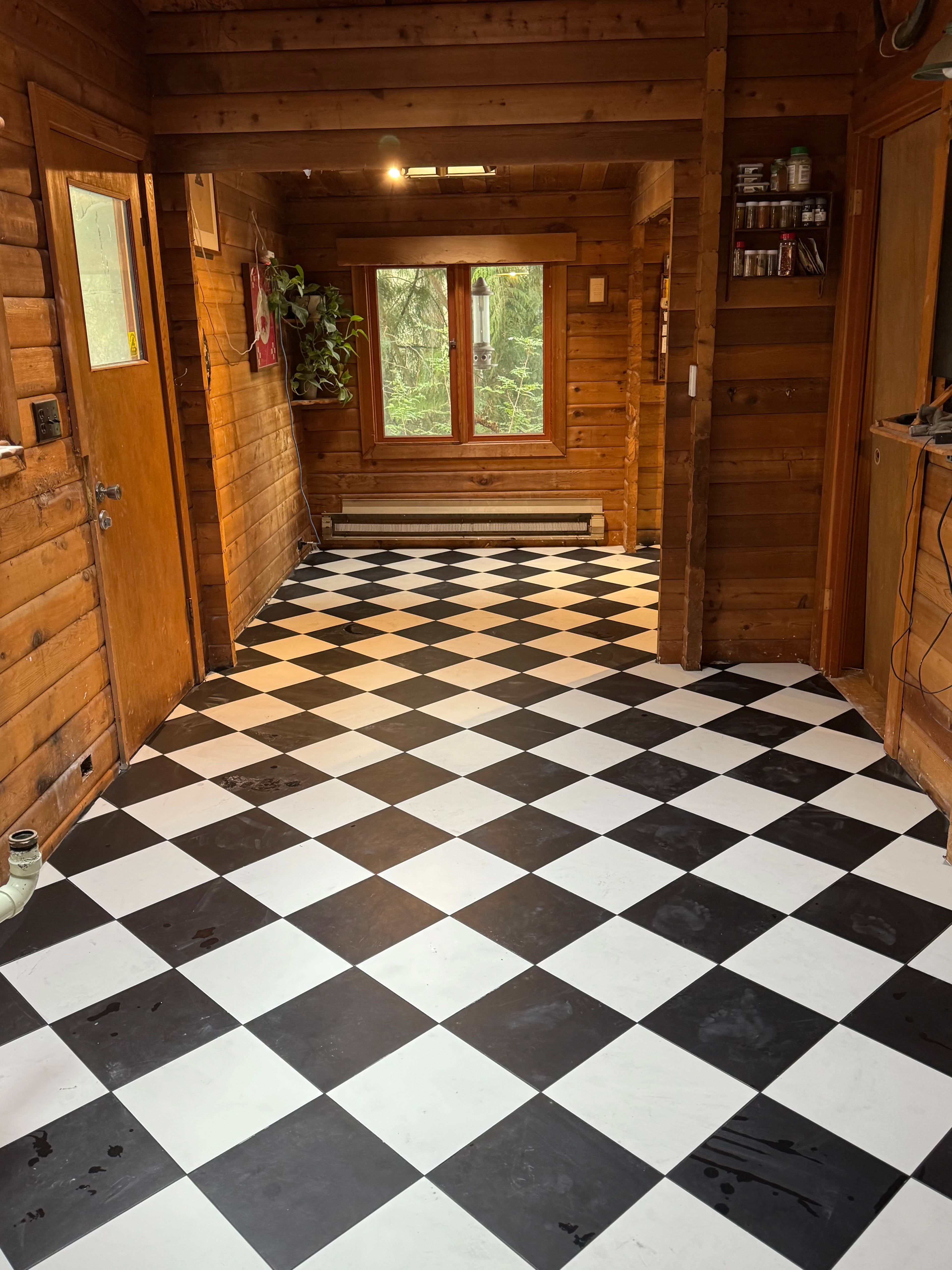 rustic checkerboard cabin kitchen by CVR Construction