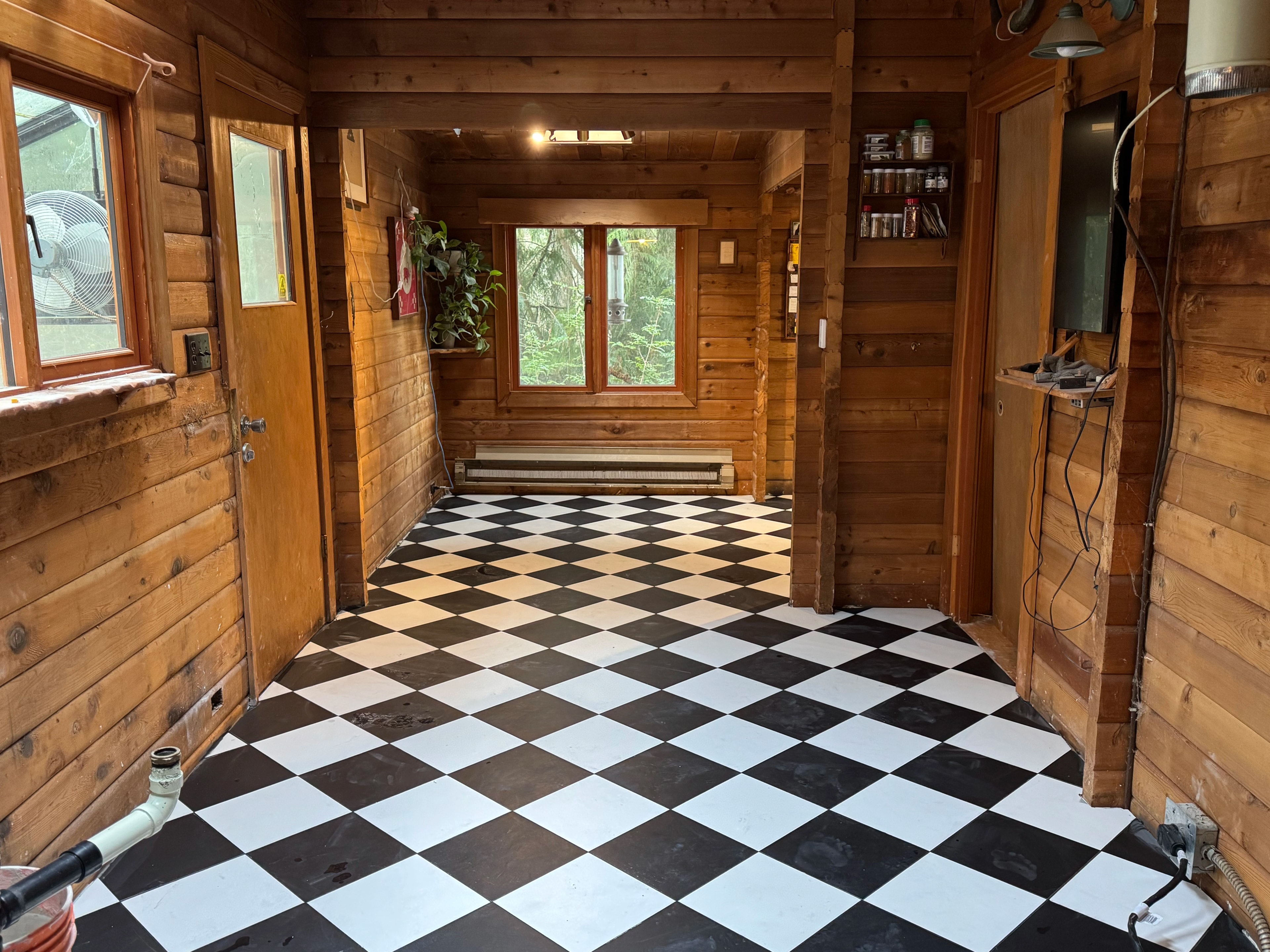 rustic checkerboard cabin kitchen by CVR Construction